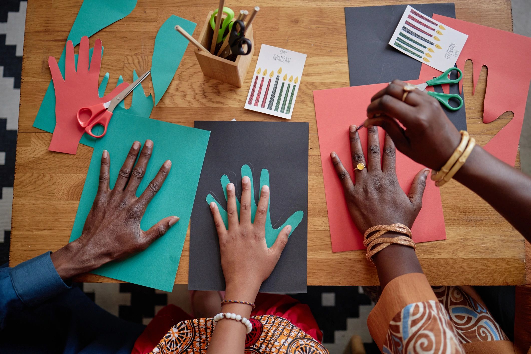 Family creating crafts together at a table