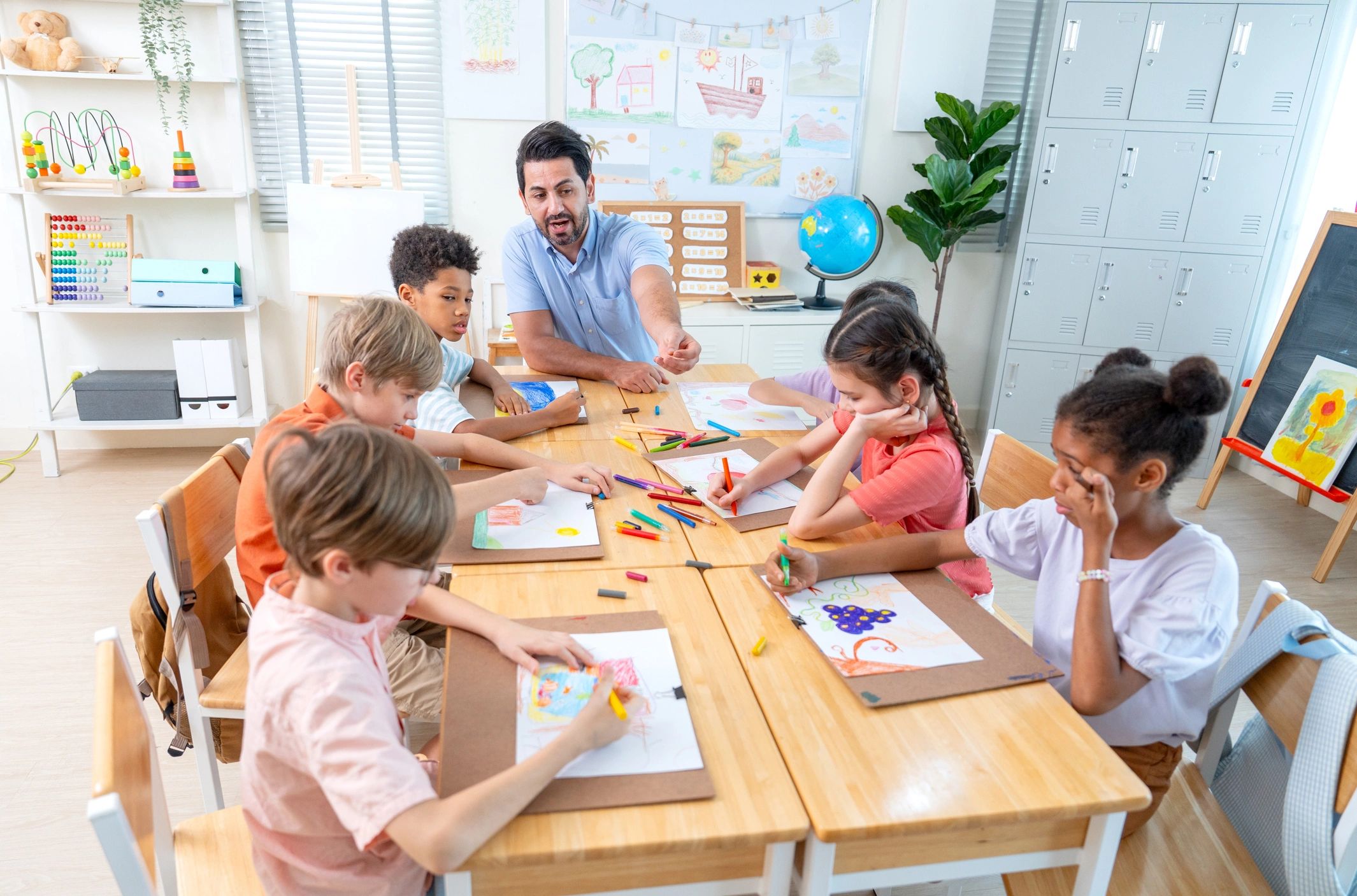 Teacher leading children in a creative art activity